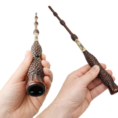 Hand holding magical fire wand grip