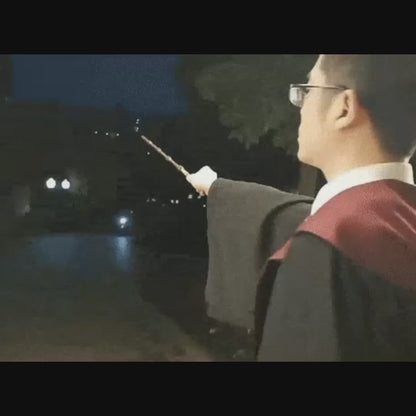 Person using a magical fire wand to cast a spell